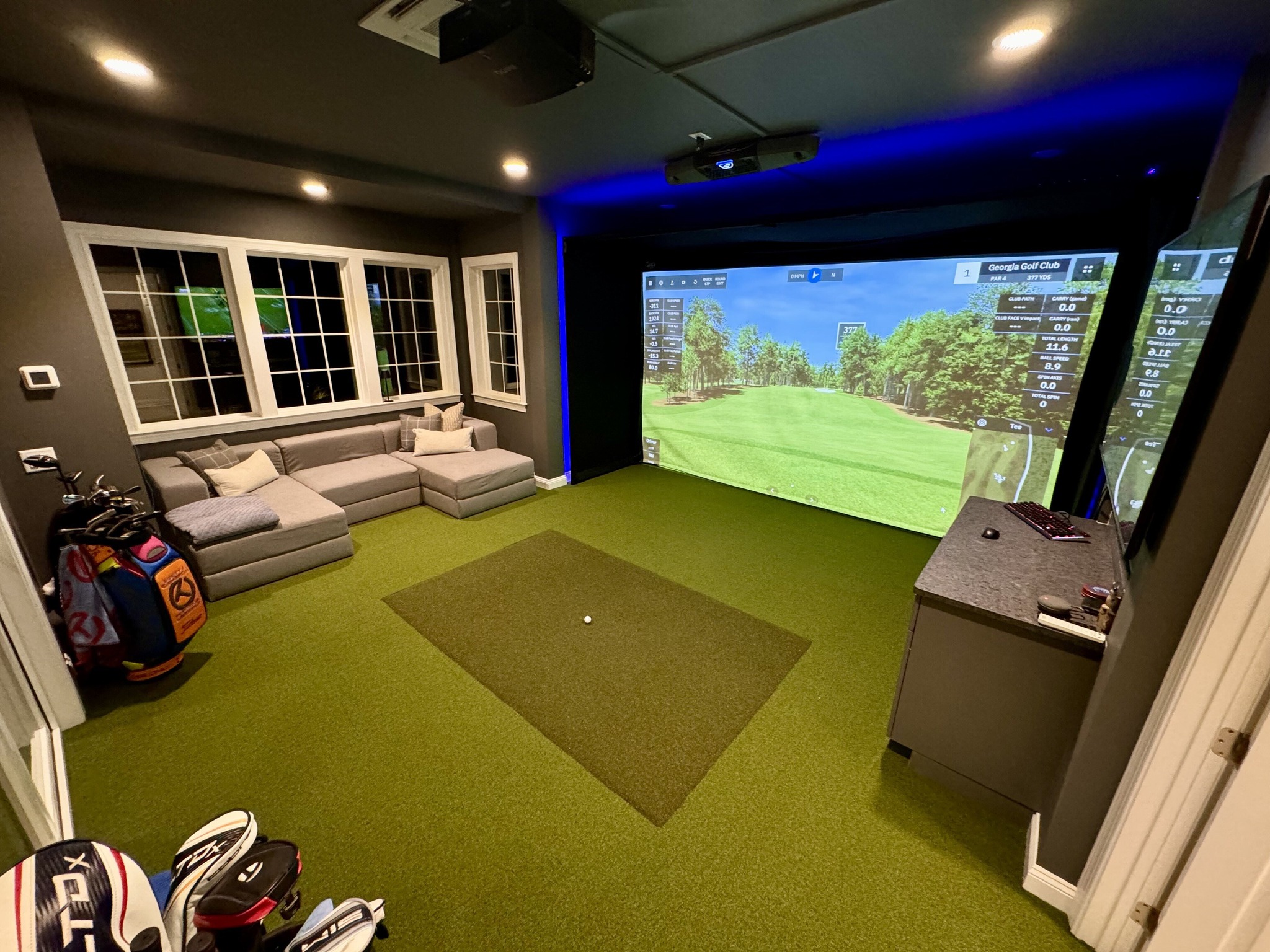 Golfer using a Golf Simulator System for Home